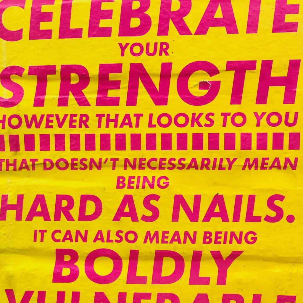 Pink text on yellow poster